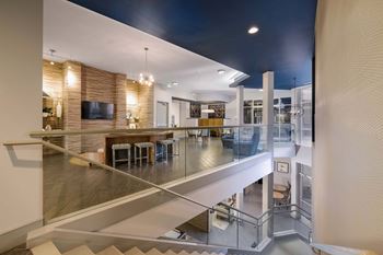 a view of a living room from a staircase